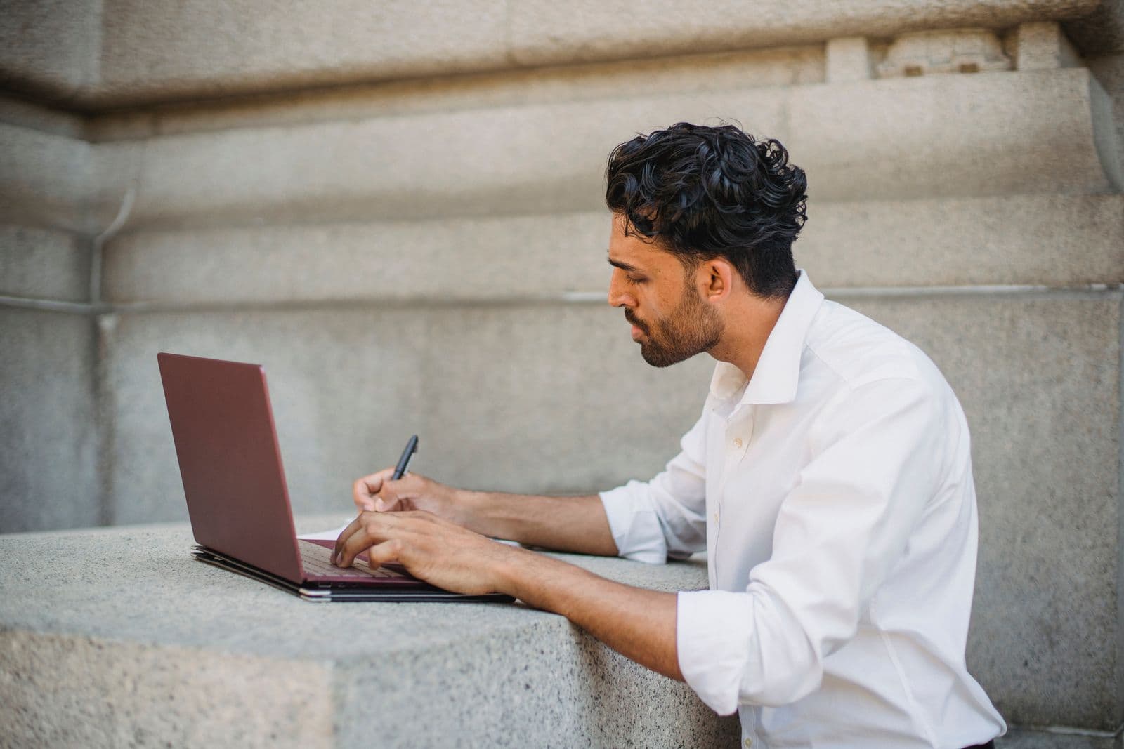 Engineer designing a solution at a laptop